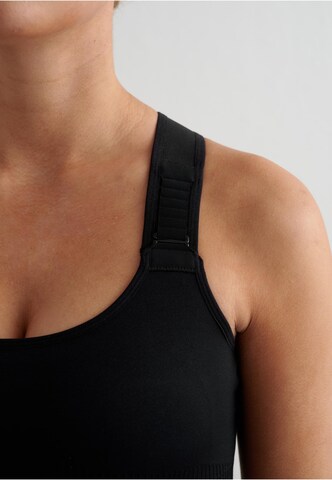 Bustino Reggiseno sportivo di Aim'n in nero