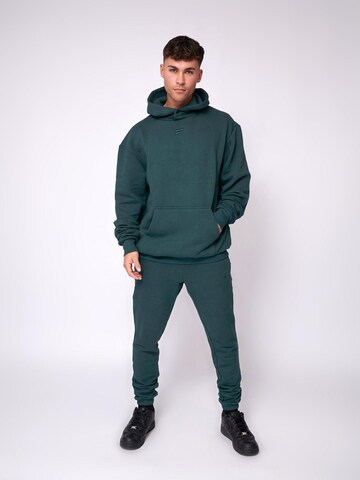 Fortex Fitness Slimfit Sportbroek 'Essential Jogger' in Groen: voorkant