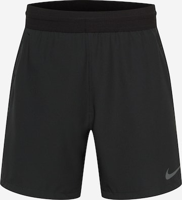 NIKE Regular Sports trousers in Black: front