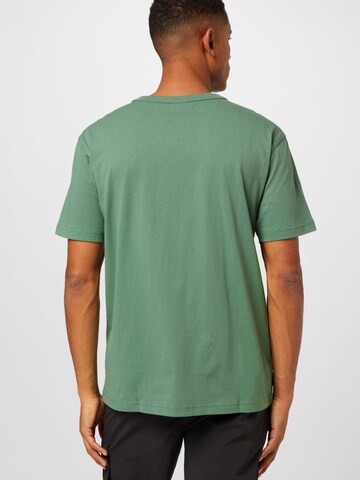PUMA Shirt 'Downtown' in Groen