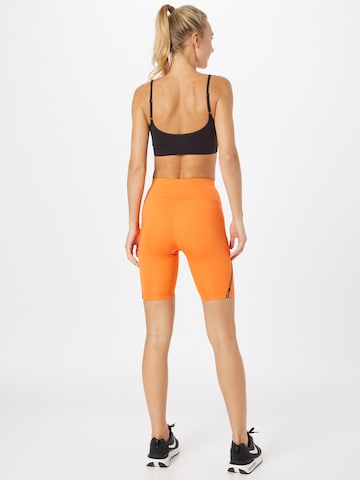 ASICS - Skinny Calças de desporto 'Race Sprinter' em laranja