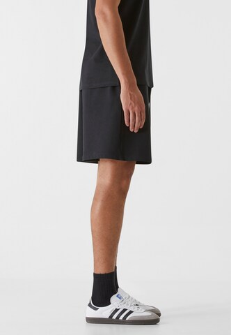9N1M SENSE Regular Trousers in Black