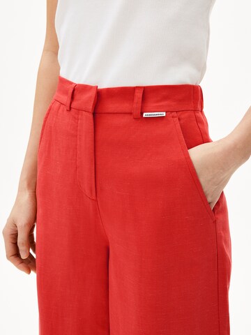ARMEDANGELS Loose fit Trousers in Orange