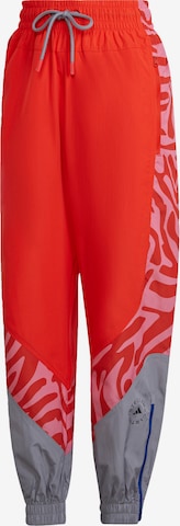 ADIDAS BY STELLA MCCARTNEY Tapered Workout Pants in Orange: front