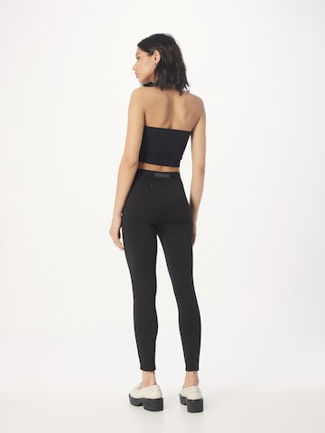 DRYKORN Skinny Leggingsit 'FAN' värissä musta