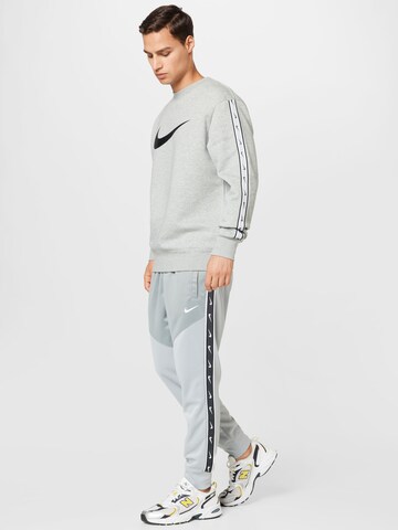 pilka Nike Sportswear Siaurėjantis Kelnės