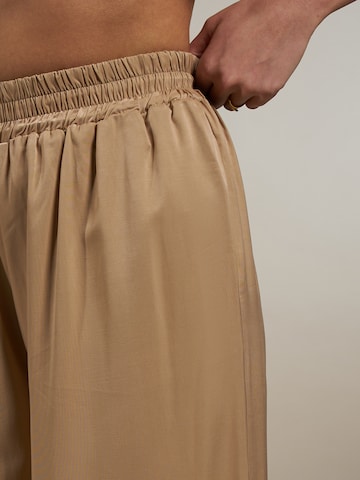 ABOUT YOU x Laura Giurcanu Wide leg Pants 'Melis' in Brown