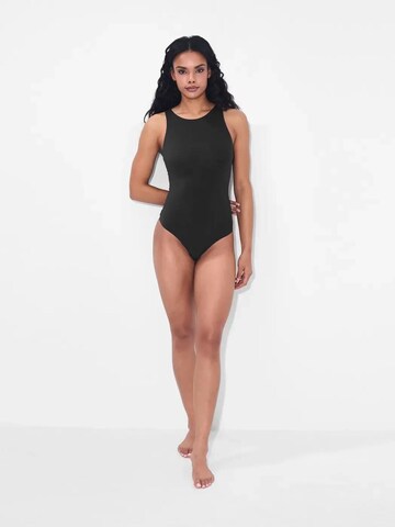 cfab by creamy fabrics Shapingbody 'Crew Neck Bodysuit String' in Zwart