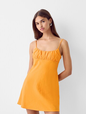 Bershka Letnia sukienka w kolorze pomarańczowy: przód