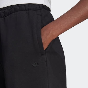 Flared Pantaloni di ADIDAS ORIGINALS in nero