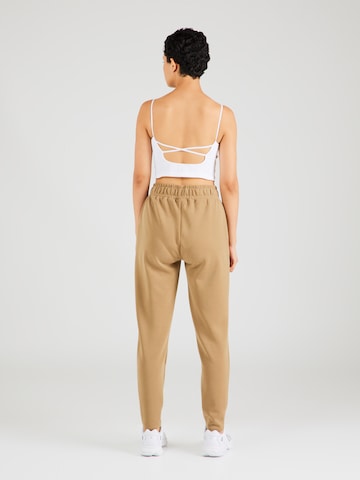 Athlecia Tapered Sporthose in Braun