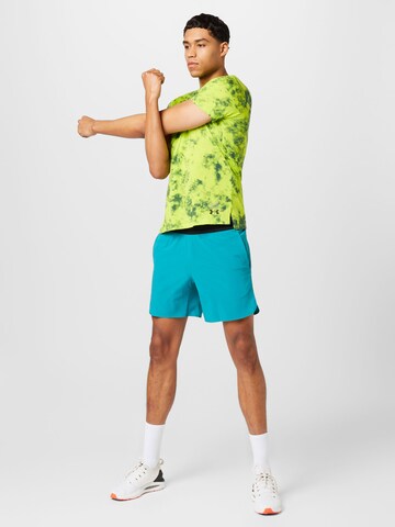 UNDER ARMOUR Regular Sportbroek 'Peak' in Blauw