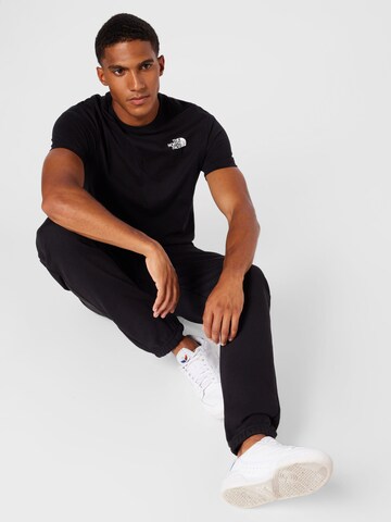 THE NORTH FACE - Tapered Calças 'ESSENTIAL' em preto