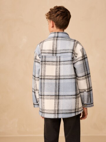 Next Přechodná bunda – modrá