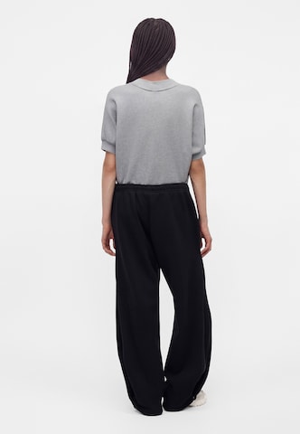 Nike Sportswear - Pierna ancha Pantalón 'Studio' en negro