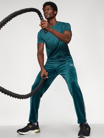 PUMA Regular Broek 'ESS' in Groen