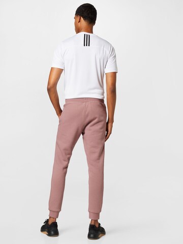ADIDAS ORIGINALS Tapered Παντελόνι 'Adicolor Essentials Trefoil' σε ροζ