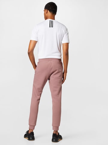 ADIDAS ORIGINALS Дънки Tapered Leg Панталон 'Adicolor Essentials Trefoil' в розово