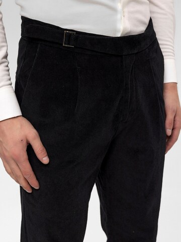 Antioch Tapered Pleat-front trousers in Black