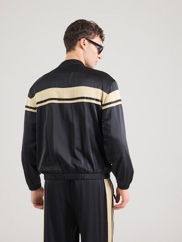Sergio Tacchini Välikausitakki 'Young Line Rayon' värissä musta