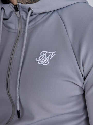 Veste de survêtement 'Poly' SikSilk en gris
