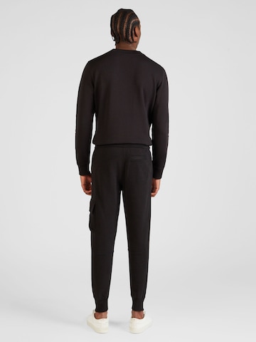 Tapered Pantaloni di Calvin Klein Jeans in nero