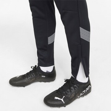 PUMA Slimfit Sportbroek in Zwart