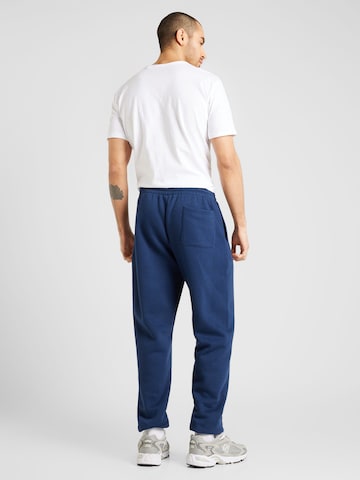new balance Zwężany krój Spodnie w kolorze niebieski