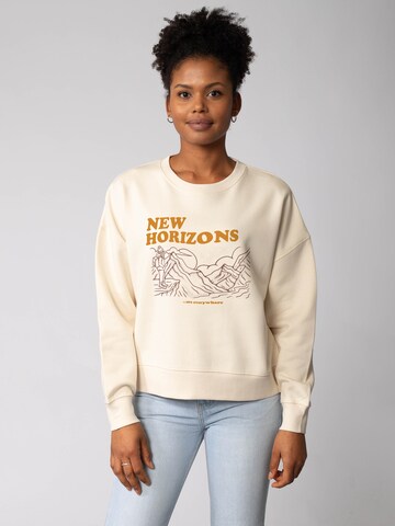 Watapparel Sweatshirt 'New horizons are everywhere ' in Beige: voorkant