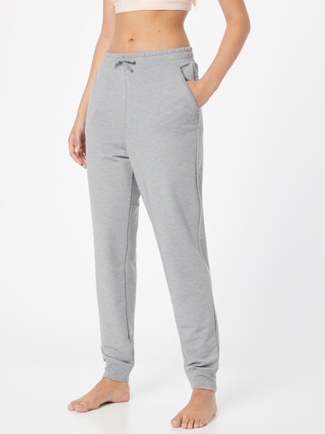 NIKE Tapered Sports trousers in Grey: front