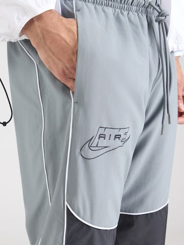 Nike Sportswear Zwężany krój Spodnie 'AIR' w kolorze szary