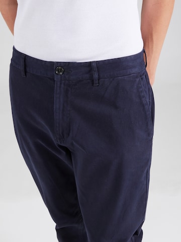 mėlyna SCOTCH & SODA Siaurėjantis „Chino“ stiliaus kelnės