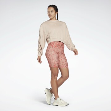 Skinny Pantaloni sportivi di Reebok in rosso