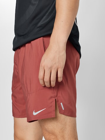 NIKEregular Sportske hlače 'Flex Stride' - crvena boja