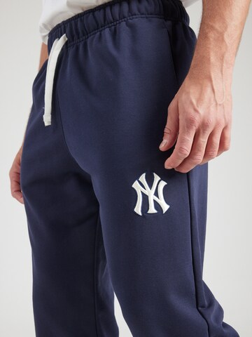 Champion Authentic Athletic Apparel - Tapered Pantalón en azul