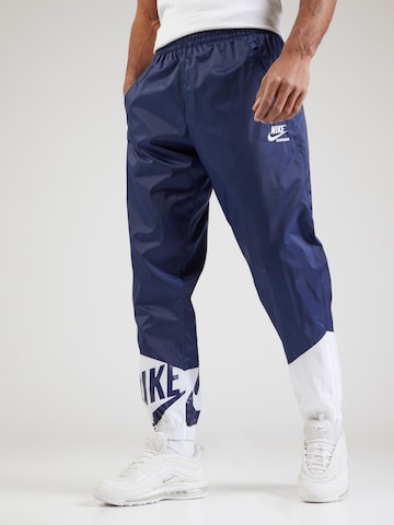 Nike Sportswear Tapered Trousers in Blue: front
