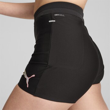 PUMA Skinny Sports trousers in Black
