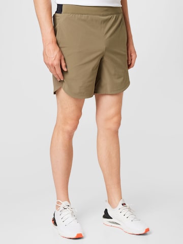 Regular Pantalon de sport UNDER ARMOUR en vert : devant