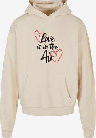 Merchcode Sweatshirt ' Valentines Day - Love Is In The Air' in Beige: voorkant