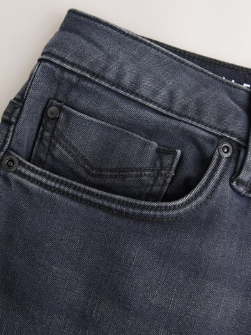 Coupe slim Jean 'Motionflex' Next en mélange de couleurs