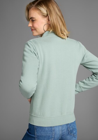 DELMAO Zip-Up Hoodie in Green