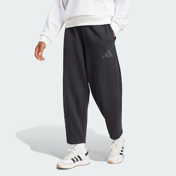 ADIDAS SPORTSWEAR Свободный крой Спортивные штаны 'Essentials' в Черный: спереди