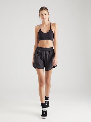 Regular Pantalon de sport 'LUX' Reebok en noir