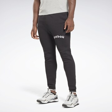 Reebok Tapered Workout Pants in Black: front