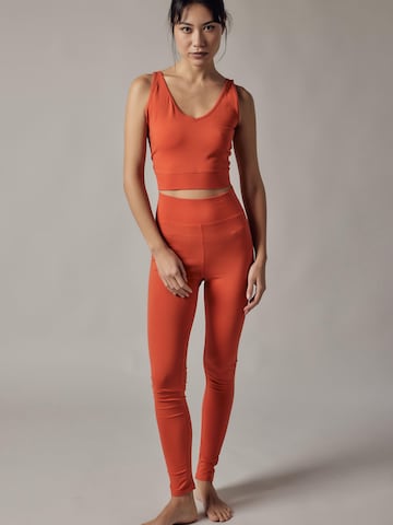 Top di OWN Off With Nature in arancione