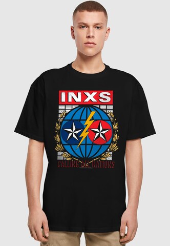 Merchcode Shirt 'INXS - Calling All Nations' in Zwart: voorkant
