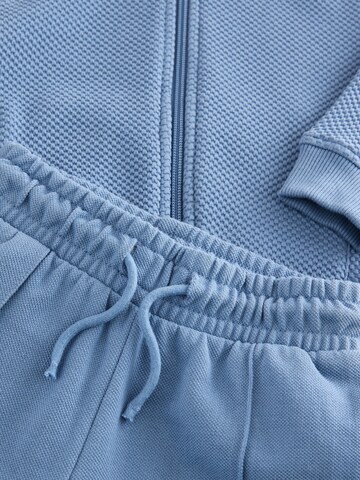 Set Next en bleu