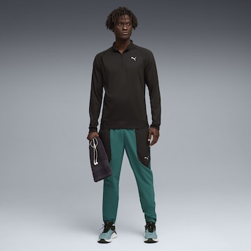 PUMA Funktionsshirt 'Pwrtrain' in Schwarz