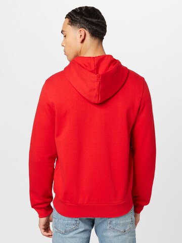 Veste de survêtement LACOSTE en rouge