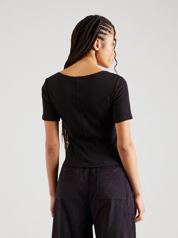 Maglietta di Champion Authentic Athletic Apparel in nero